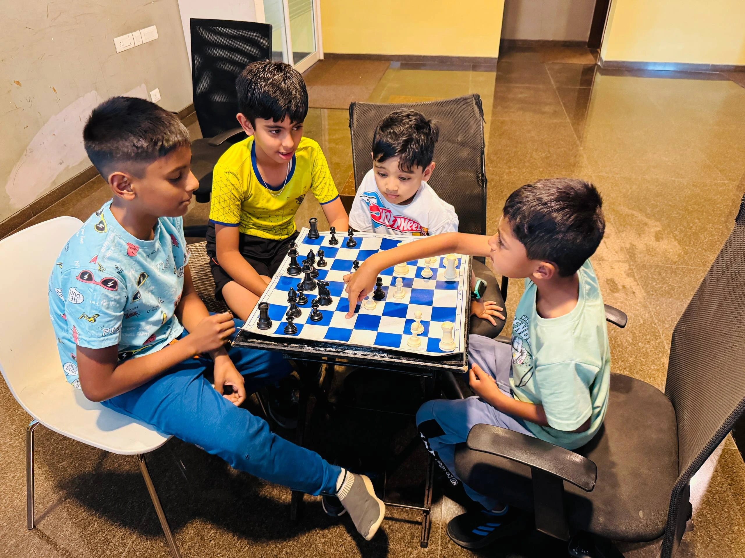 Children practicing chess in a group during weekend session