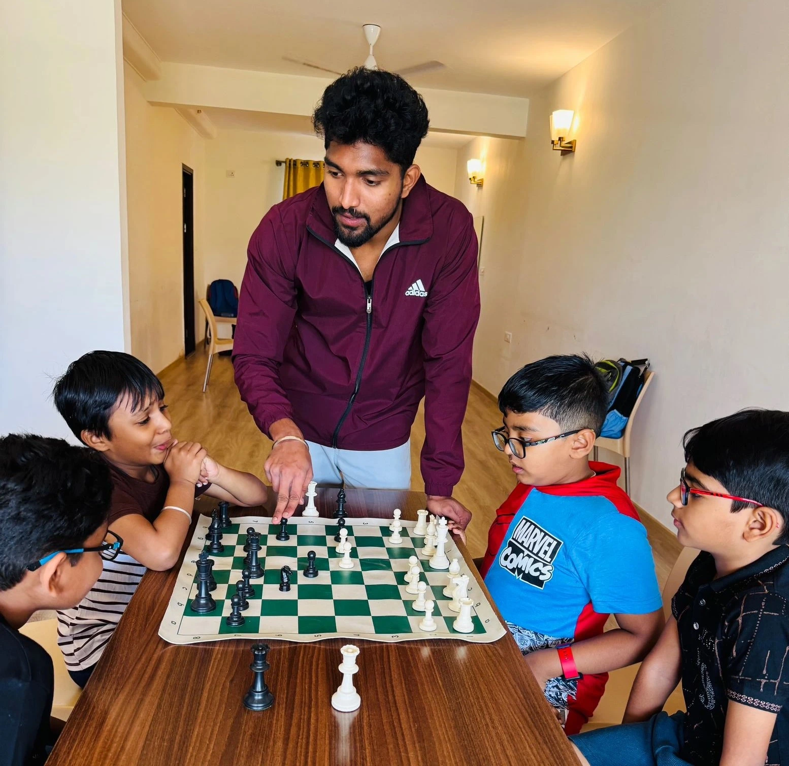 Group of kids practicing chess at GKS Academy